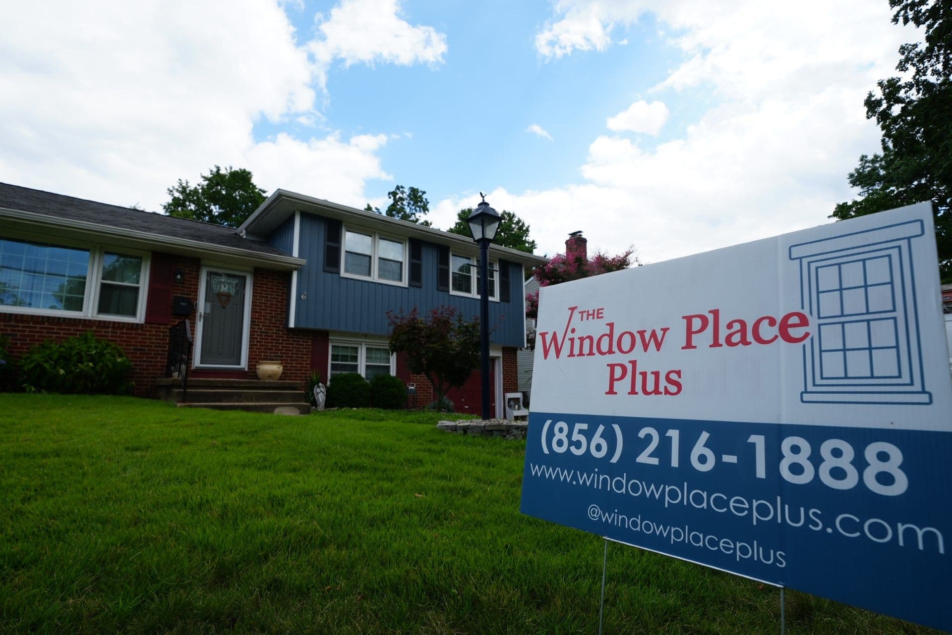 Home Exterior with Window Place Plus sign in front yard